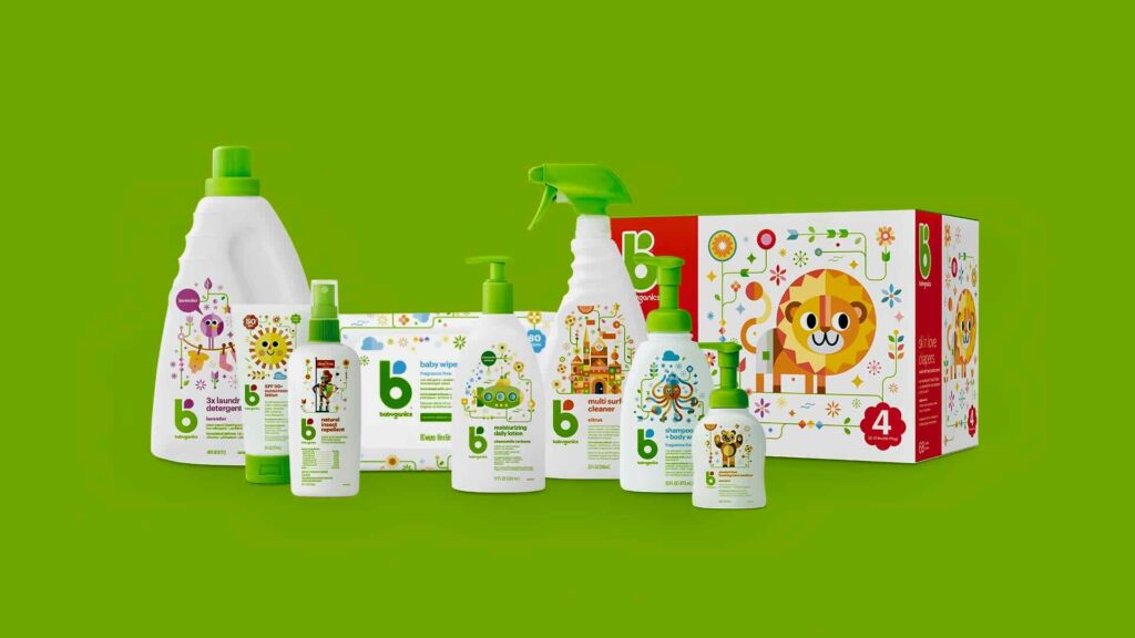 Various baby-safe cleaning products, including sprays and detergents, arranged on a green background. The packaging, perfect for content marketing campaigns, features bright, playful animal illustrations.