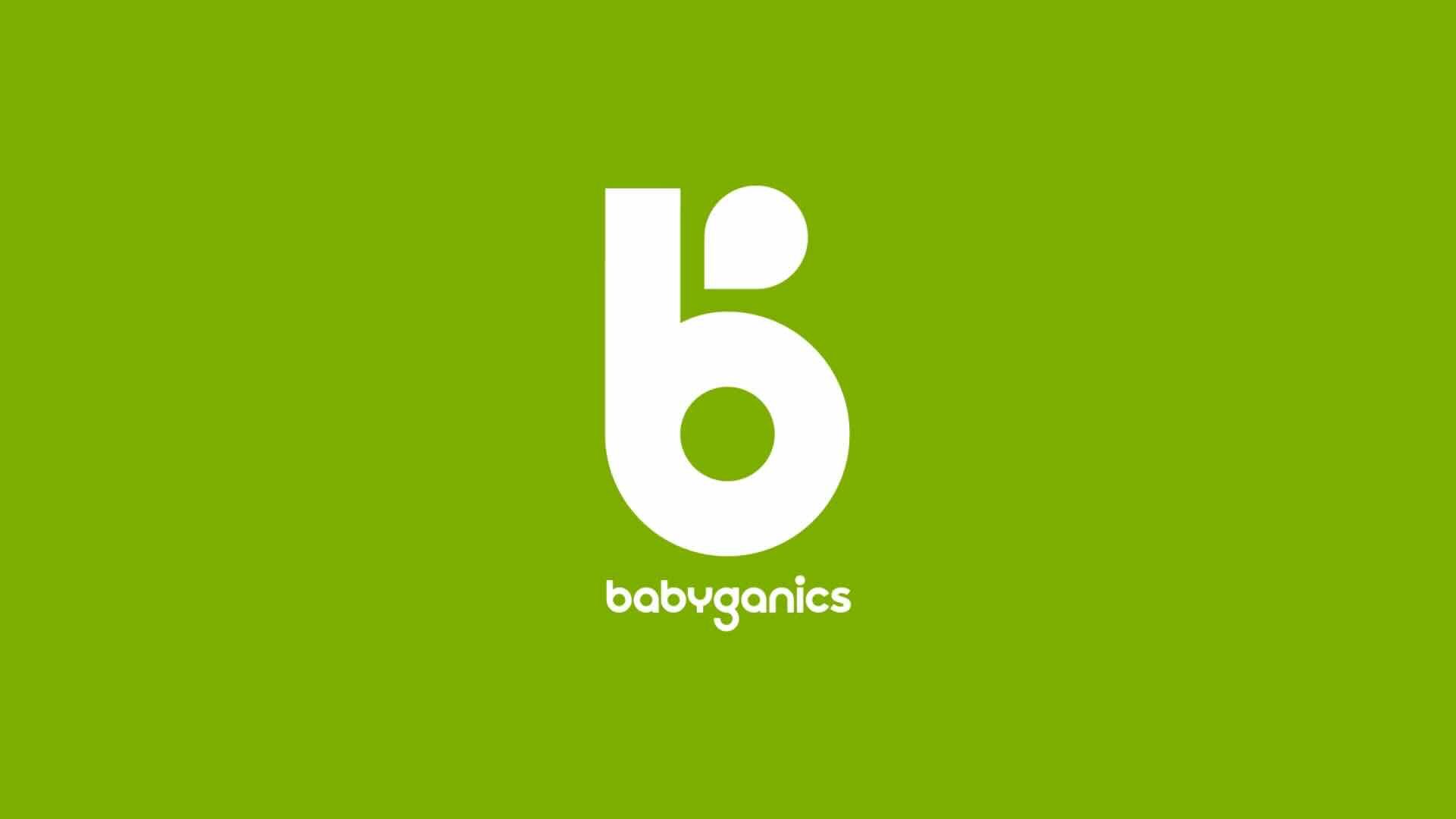 The image showcases the Babyganics logo, with a stylized lowercase "b" and the brand name "babyganics" beneath it, all in white on a green background. Perfect for millennial families embracing adventurous parenting through learning and discovery.