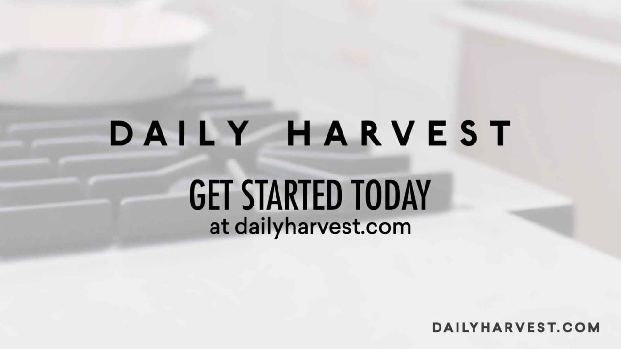 A blurred kitchen background with text: "Daily Harvest. Chef-crafted, plant-based meal delivery. Get started today at dailyharvest.com." Daily Harvest logo and website appear on the image, highlighting their commitment to sustainability and convenience for the health-conscious consumer.